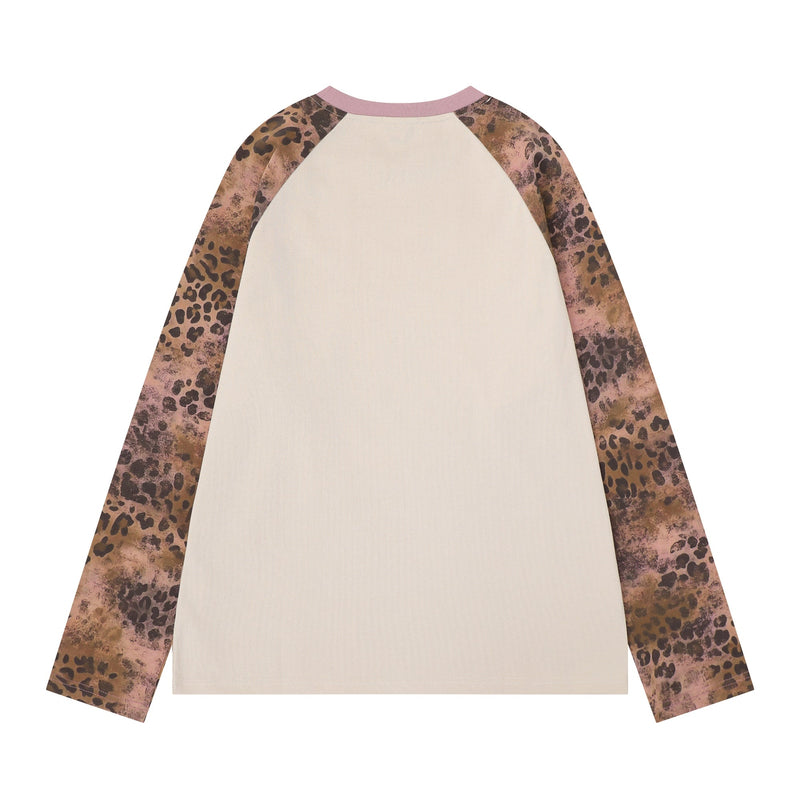 Back view of cream raglan long sleeve tee with pink collar and leopard print sleeves