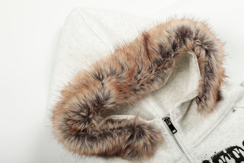 Close-up of white hoodie faux-fur collar and hood opening with zipper visible
