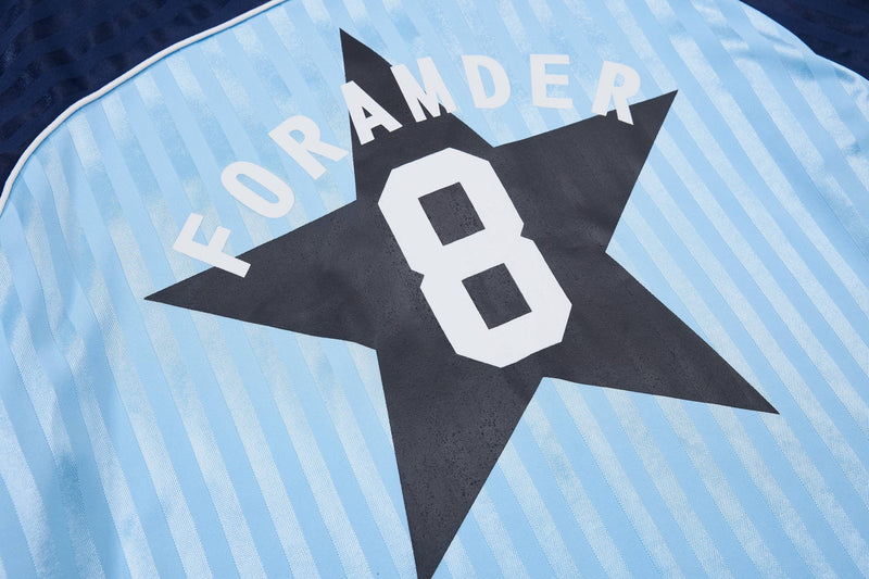 Light blue striped football jersey tee with a black star graphic and bold FORAMDERGTS lettering on the chest