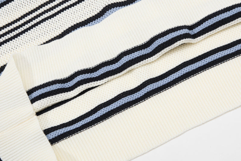 Cream knit polo shirt with black and blue retro stripes and textured cotton fabric detail