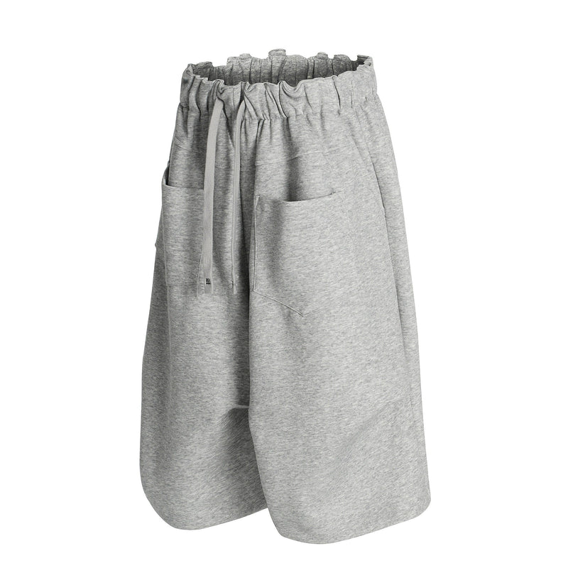 Gray wide-leg shorts front view with elastic waist, drawstring, and patch pockets