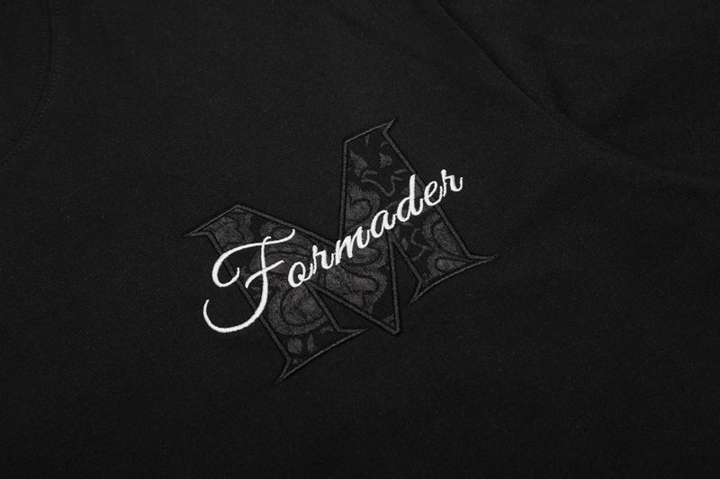 Black streetwear T-shirt with a floral panel logo and cursive Formader graphic on the chest