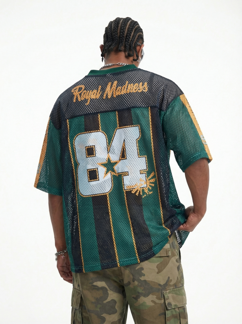 Back view of a green and black mesh jersey T-shirt with Royal Madness 84 graphic and striped streetwear design