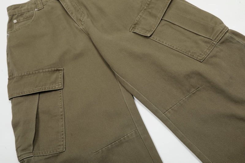 Angled side view of olive cargo jeans showing cargo pocket and wide-leg silhouette