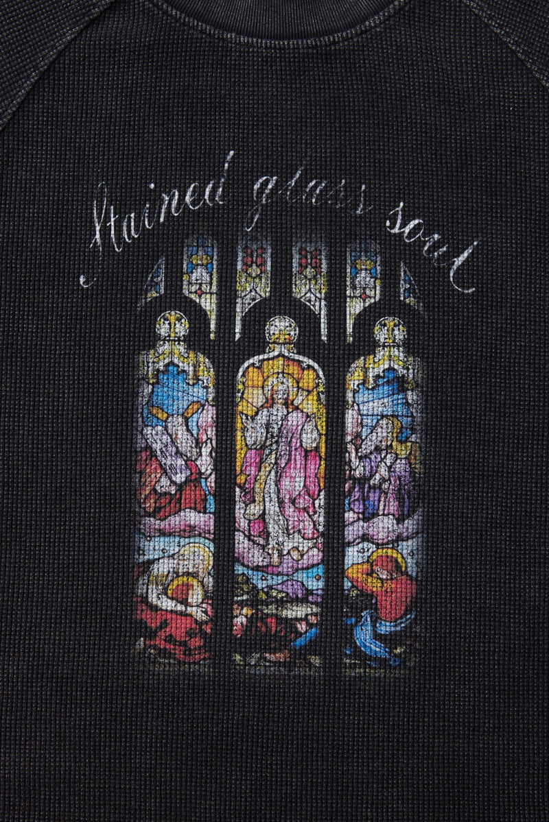 Black graphic T-shirt with colorful stained glass-style soul artwork and curved handwritten text on the chest