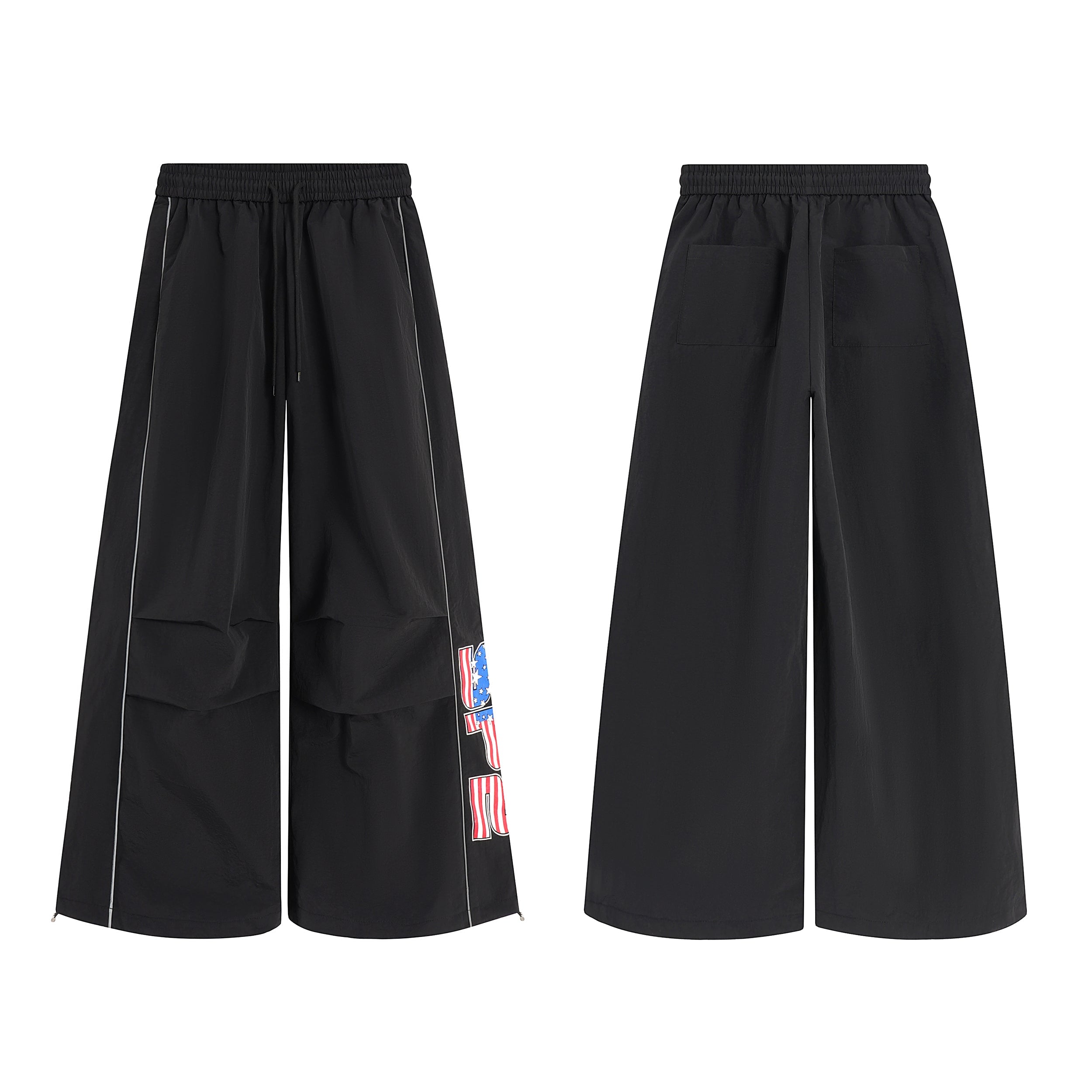 Black wide-leg nylon pants with American flag graphic print on the right leg, shown front and back on white background