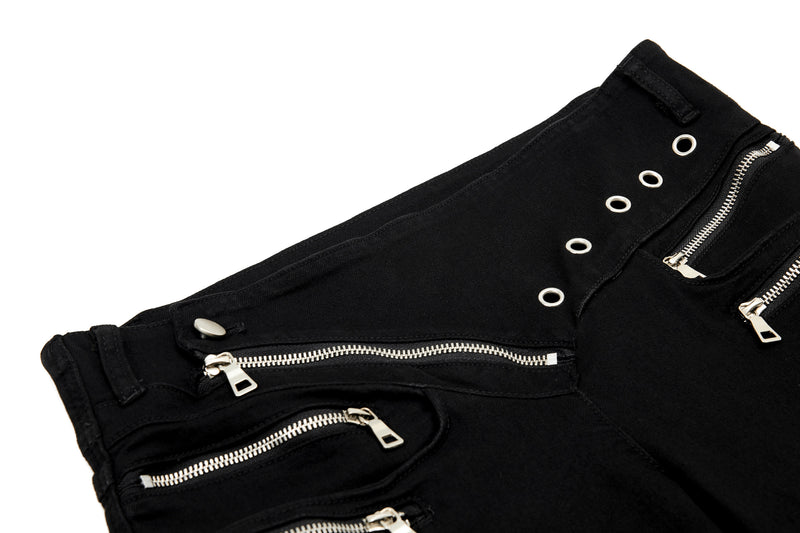 Close-up of black waistband with diagonal zipper and silver grommets