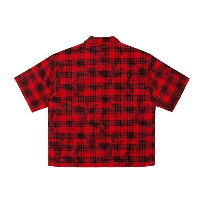 Back view of red and black plaid cropped button-up shirt with grunge wash pattern