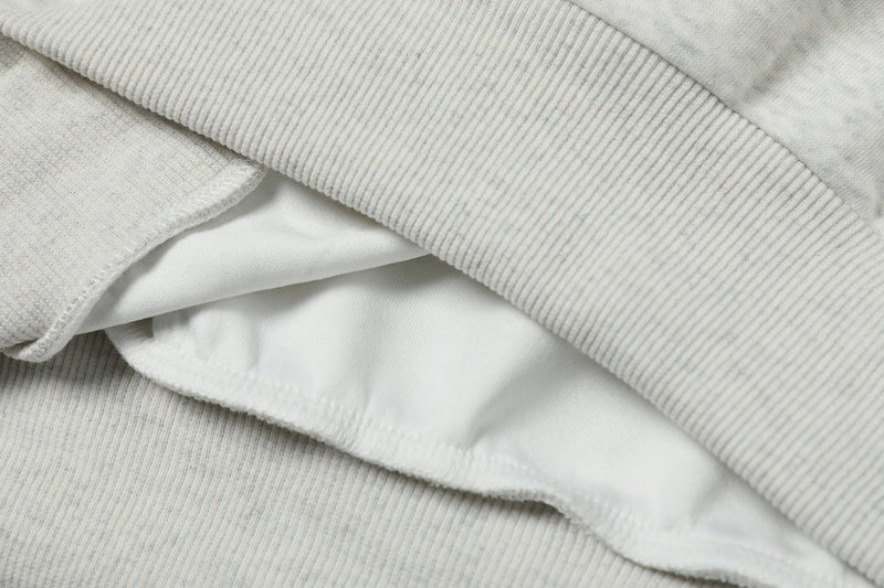 Close-up of sweatshirt fabric layers and ribbed collar detail