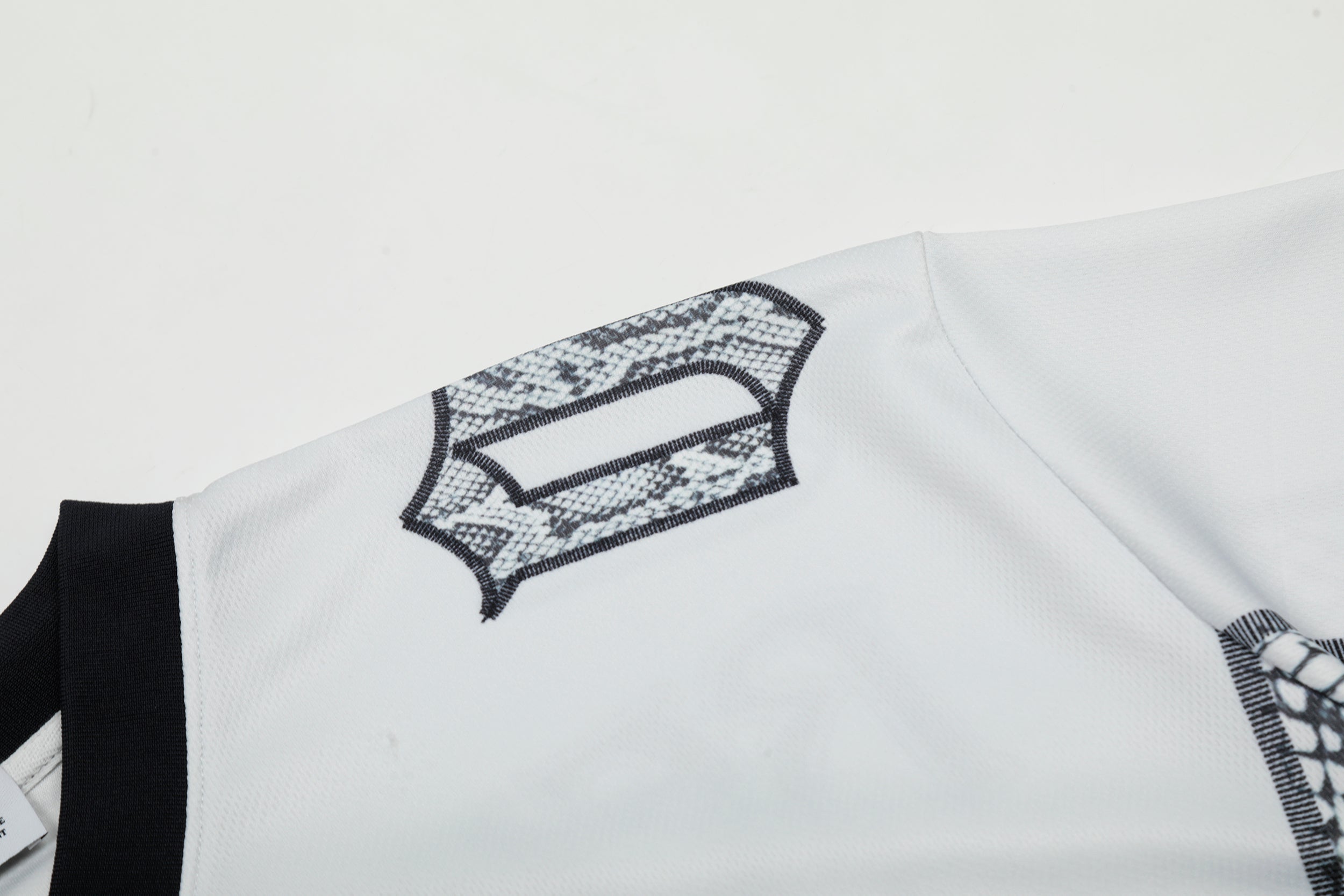 Omirad Reach High Snakeskin Gothic Jersey Tee | Streetwear