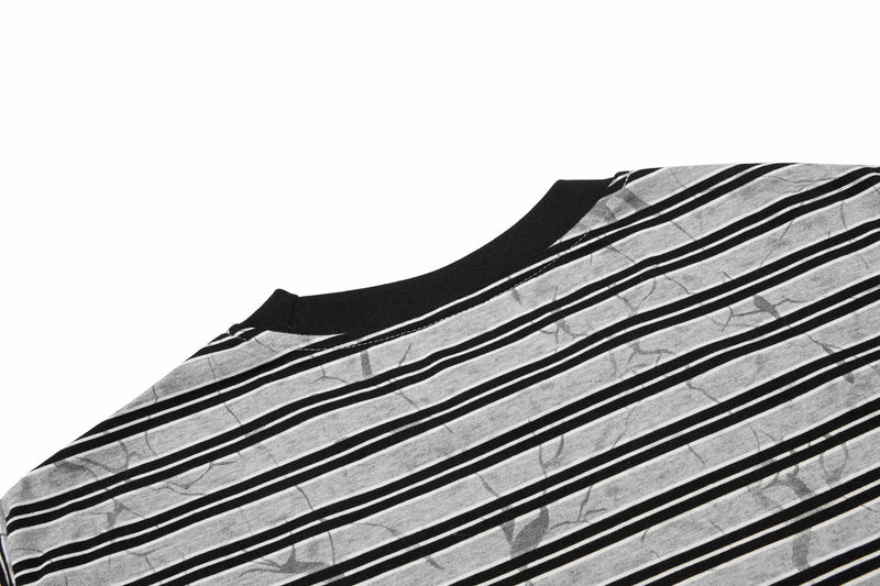 Black and white striped cotton T-shirt with graffiti-style abstract pattern and ribbed crew neck