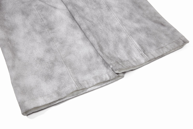 Close-up of straight hem and side seam on gray washed wide-leg pants