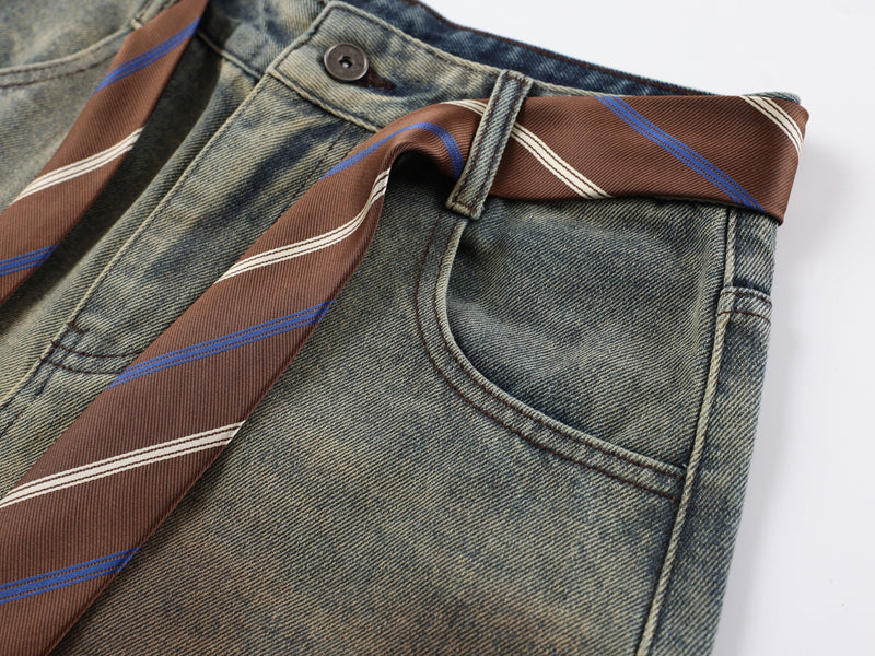 Close-up of back pocket and waistband on striped tie-waist denim pants