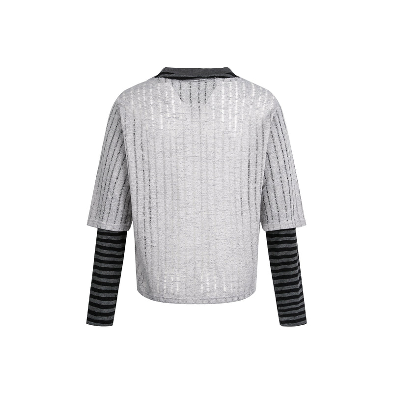 Back view of gray layered sweater top with black striped long sleeves