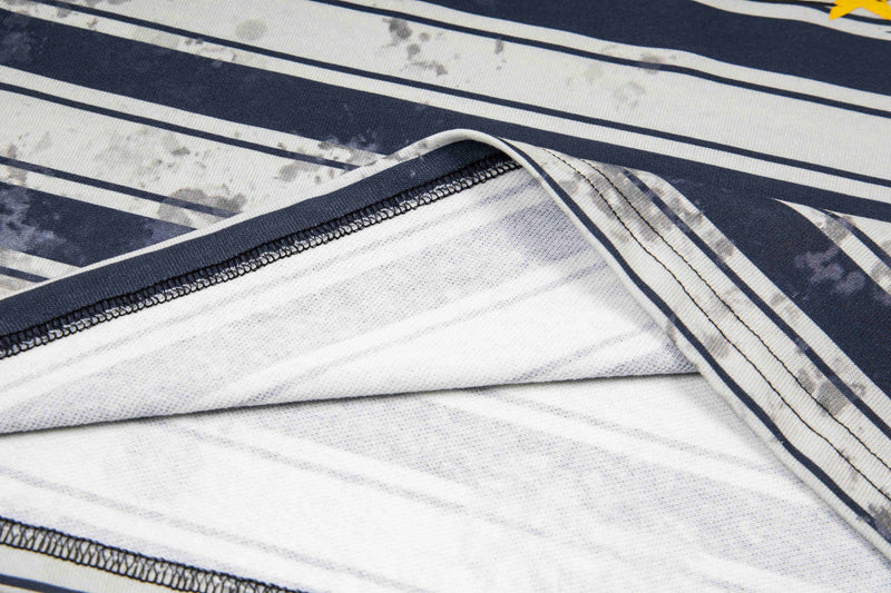 Close-up of a vintage striped oversized polo tee in navy and white with visible stitched seams and soft fabric texture