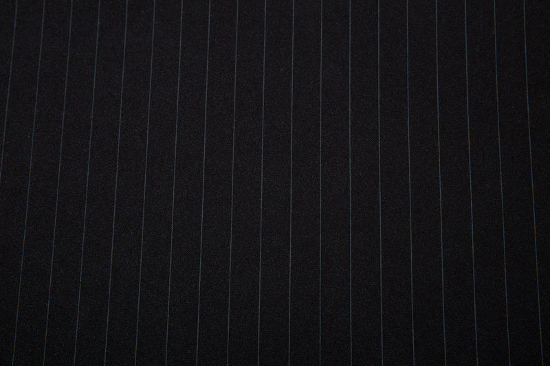 Close-up of black pinstripe jersey fabric on the body panel