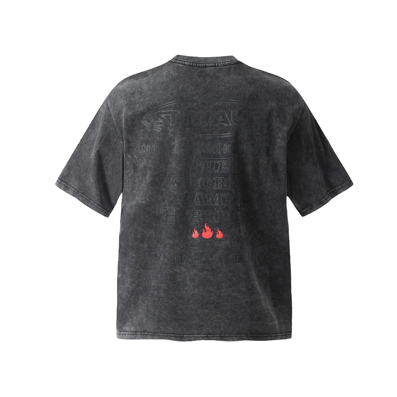 Washed black oversized cotton T-shirt with faded back graphic and red flame print on the lower back