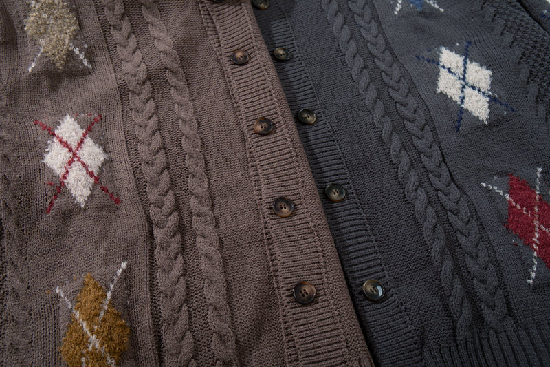 Brown and dark charcoal cardigan front laid side by side to show color options