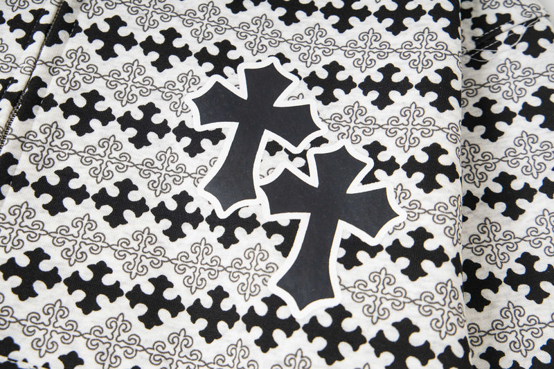 Close-up of front cross graphic on black and white hoodie