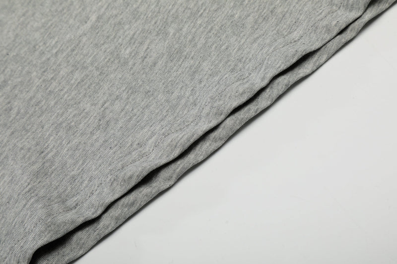 Close-up of gray tee fabric with side seam