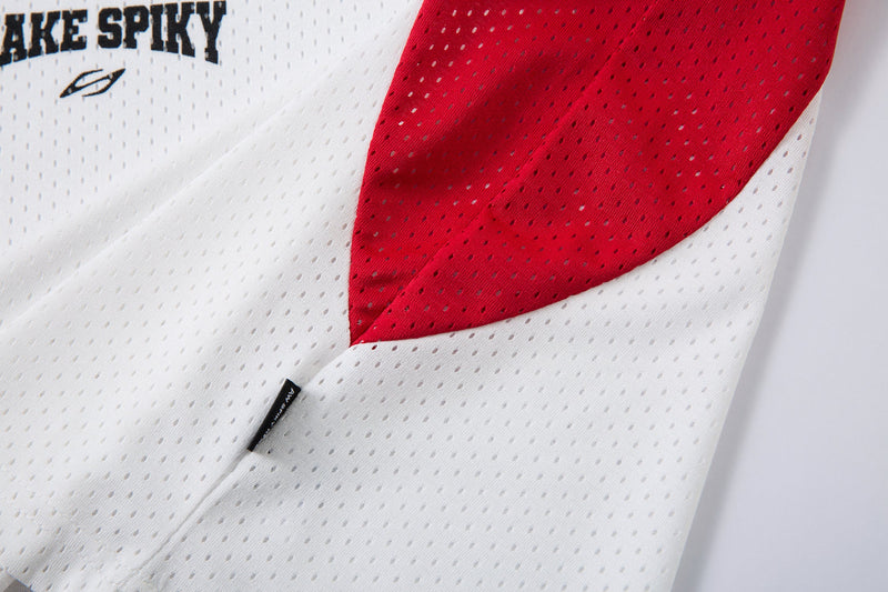 White and red mesh polo shirt with curved colorblock panel and Spikyhead logo detail