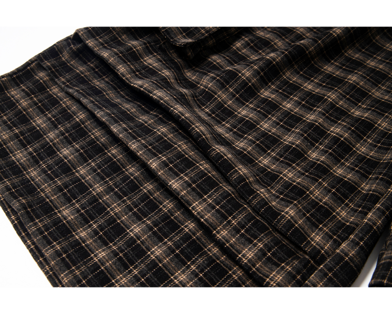 Close-up of plaid leg panel with stitched seam detail
