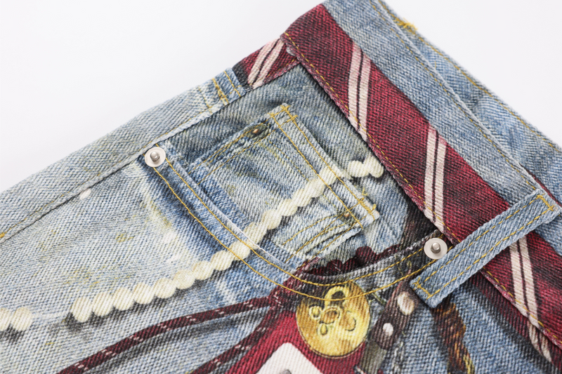 Close-up of front pocket area with light denim, bead trim, and striped waistband detail
