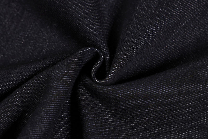 Close-up of black denim fabric texture and weave