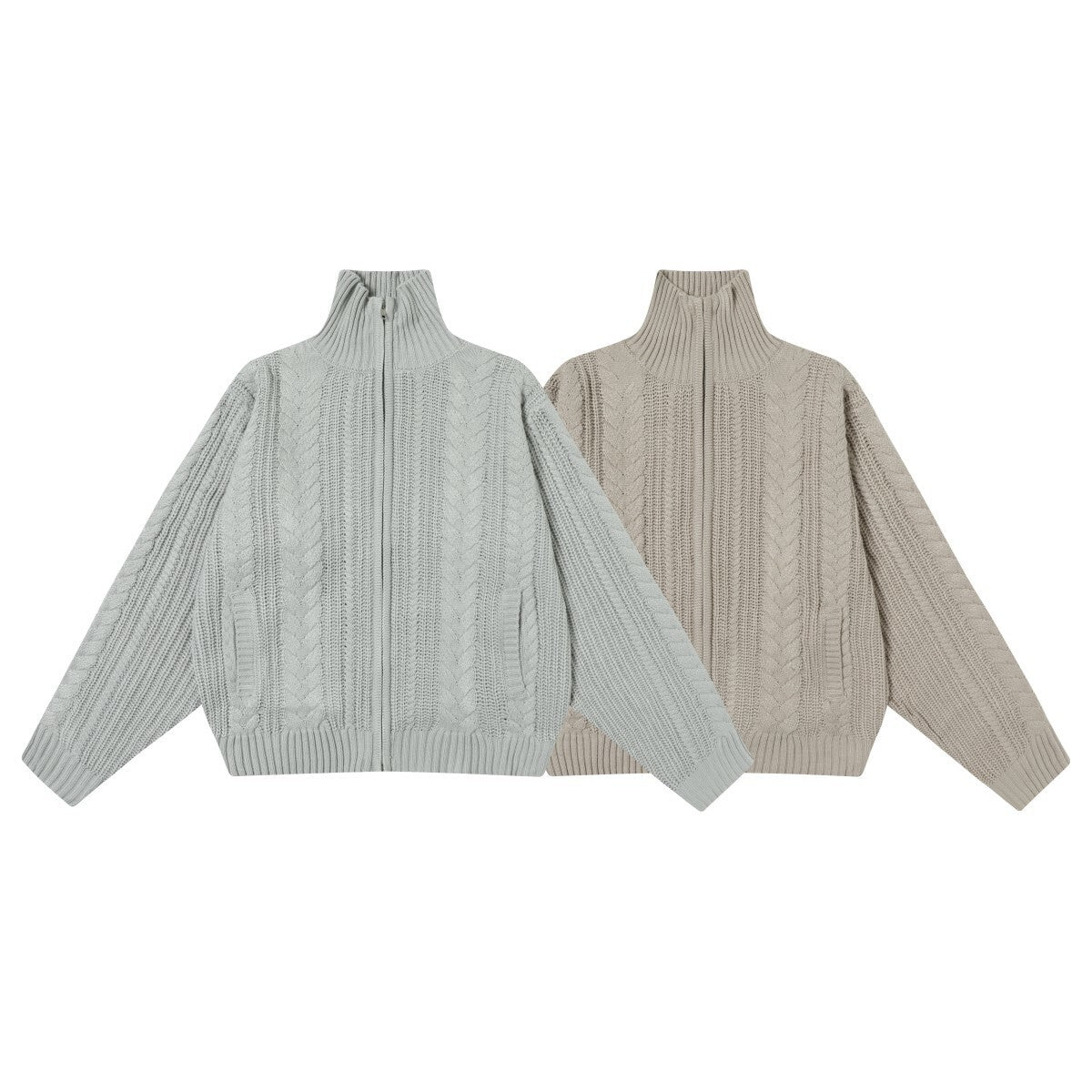 Oversized cable knit zip-up turtleneck sweater in sage green and stone beige, laid flat on white background