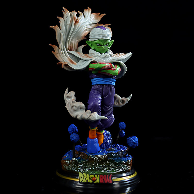 The Seakoff Dragon Ball Z Collectible Figure Set showcases a 17cm Piccolo with green skin, pointed ears, a turban, a cape, and purple pants. He stands on a rocky &quot;Dragon Ball&quot; base with crossed arms and an intense expression. Includes Vegeta and Cell variations.