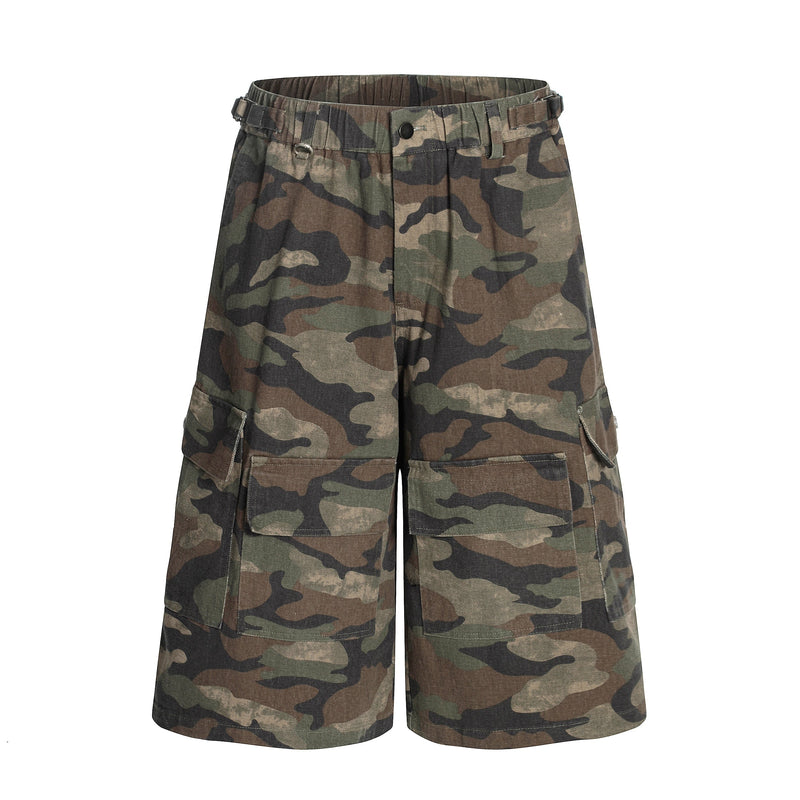Front view of green brown camo cargo shorts with elastic waistband and utility pockets