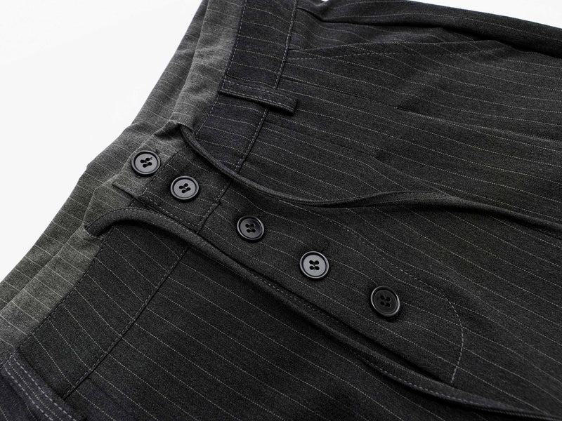 Close-up of charcoal pinstripe shorts front placket and buttons