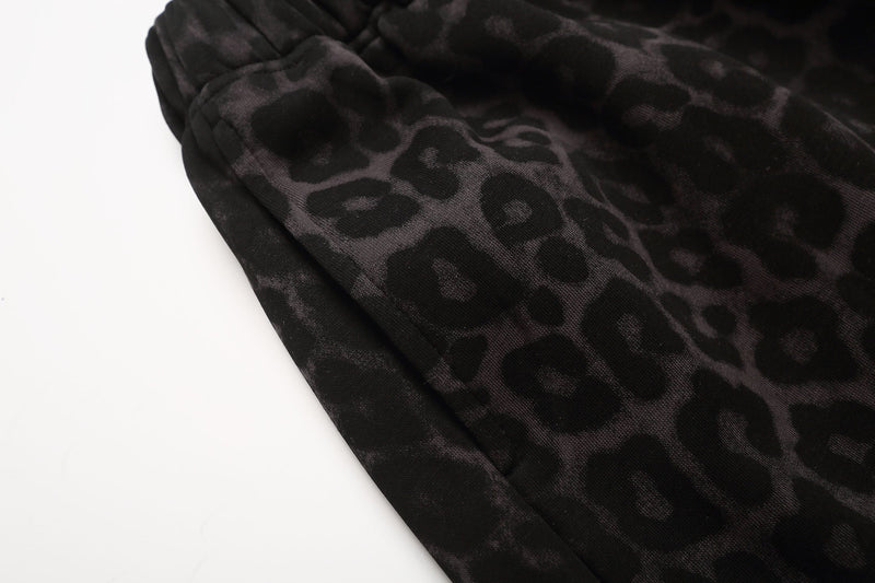 Close-up of black leopard print fabric and elastic waistband detail