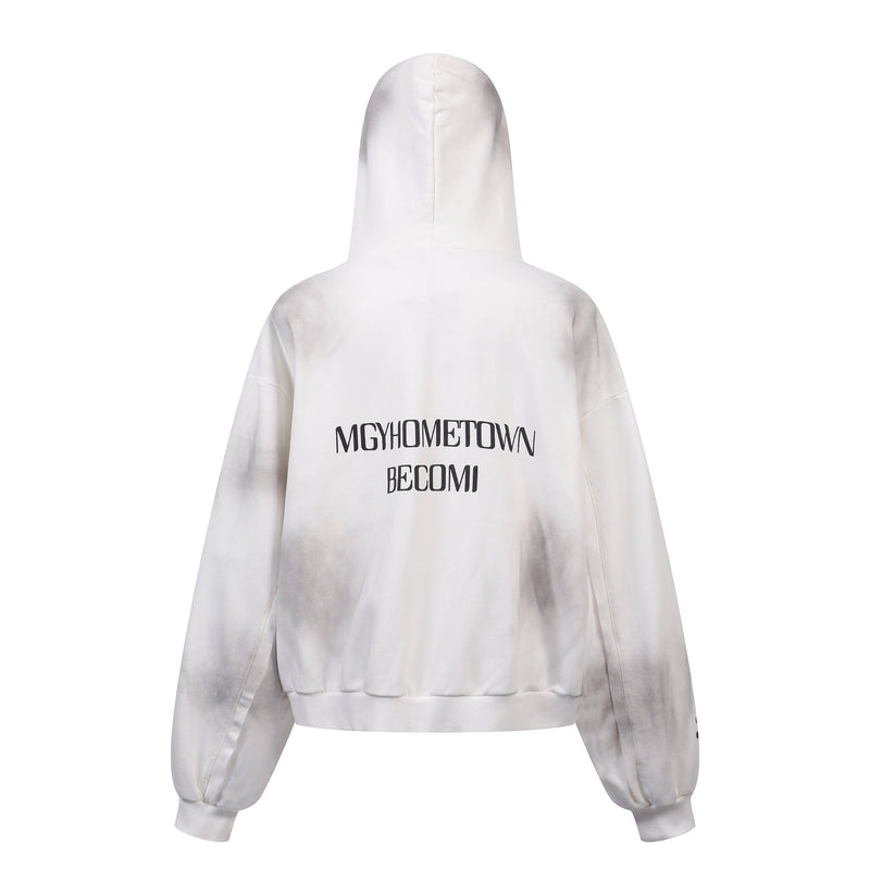 Back view of white distressed zip hoodie with black text graphic and faded gray shading at the sleeves