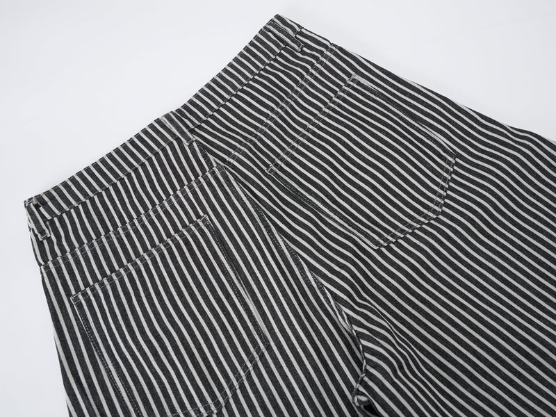Close-up of striped jeans back waistband and rear pocket seam details