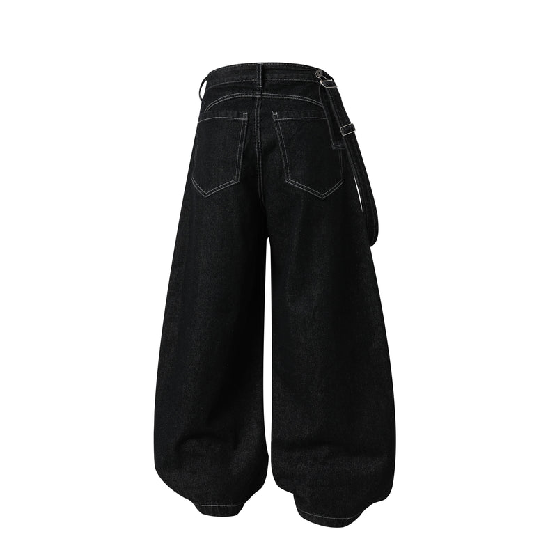 Back view of black wide-leg jeans with belt loops, rear pockets, and hanging side strap