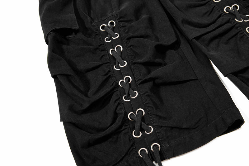 Black shorts lace-up leg panel with metal eyelets, close-up