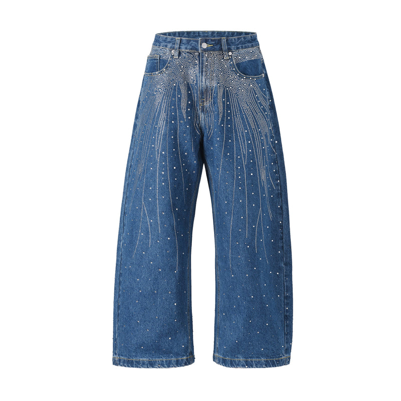 Front view of blue wide-leg denim jeans with rhinestone burst pattern across the thighs and legs