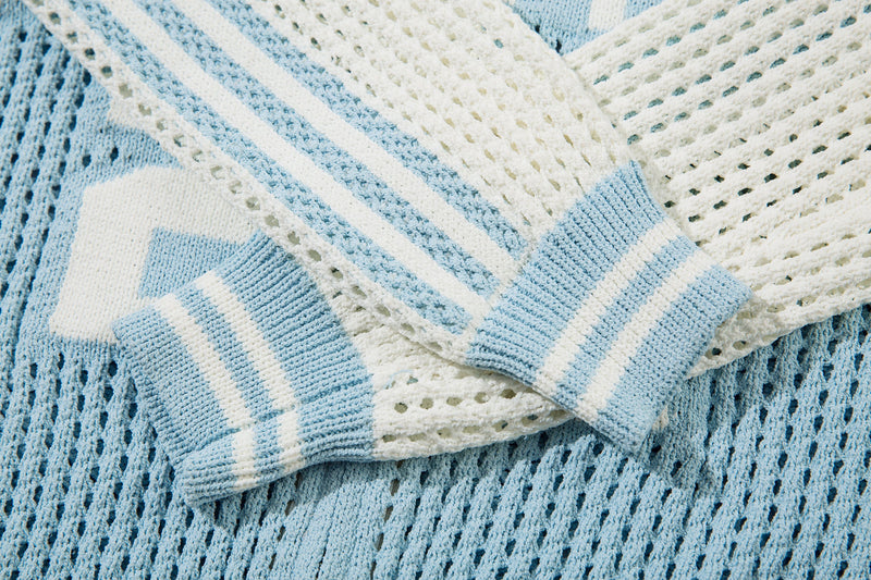 Close-up of light blue striped sleeve cuffs and mesh shoulder detail