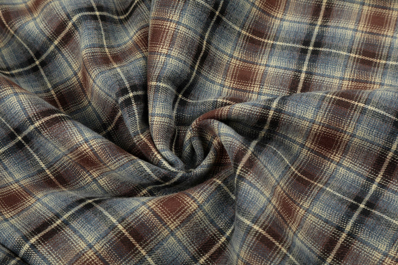Close-up of gathered plaid fabric on lounge shorts