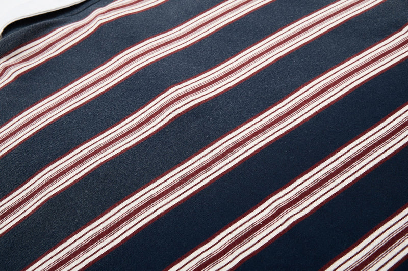 Navy vintage rugby polo shirt fabric with diagonal burgundy and cream stripes, retro 90s style