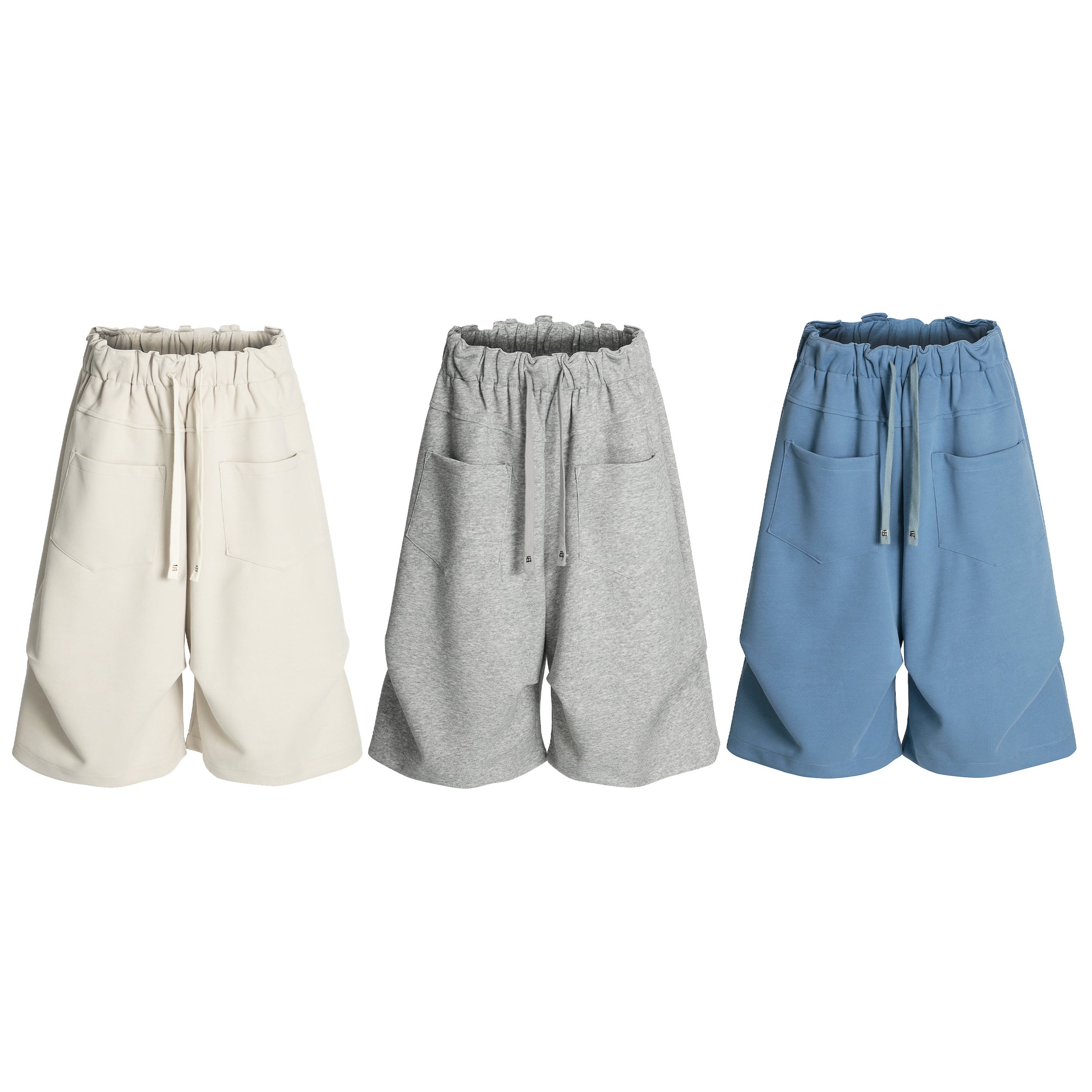 Omirad Minimal Lounge Wide Shorts in cream, grey, and blue with elastic drawstring waist and patch pockets