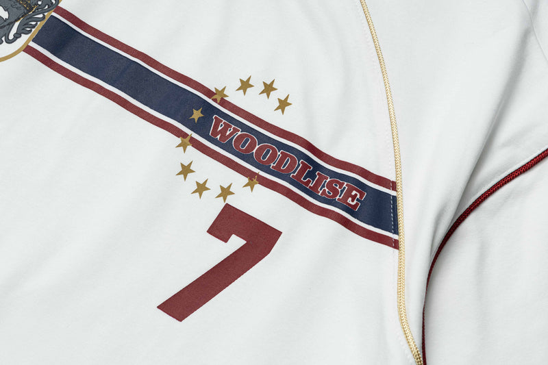 White retro football jersey tee with diagonal WOODLISE stripe, gold stars, and maroon number 7 detail