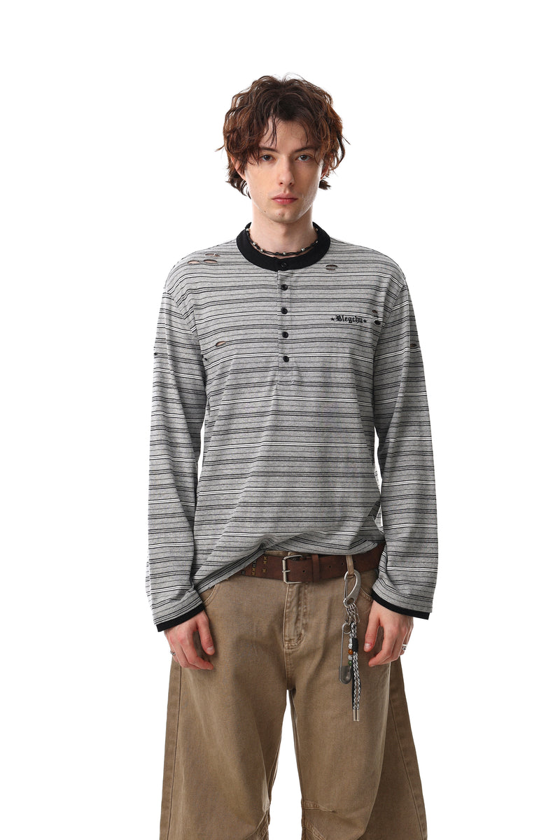 Model wearing gray striped Henley long sleeve tee with distressed holes and black collar