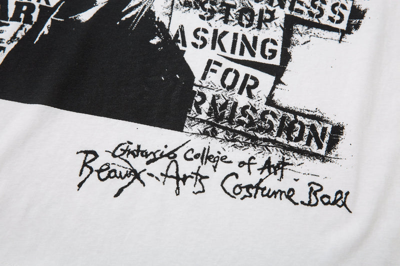 Close-up of front graphic lower section with portrait, slogan text, and handwritten details