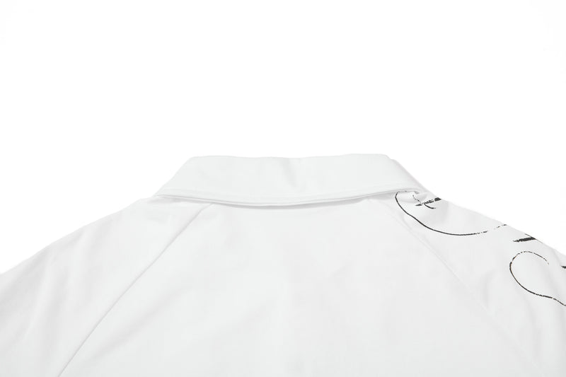 White distressed polo shirt with a wide collar and subtle black graphic print on the shoulder