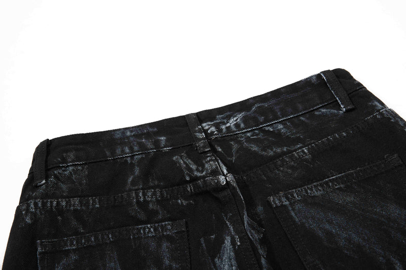 Back waistband close-up of black washed denim with belt loops