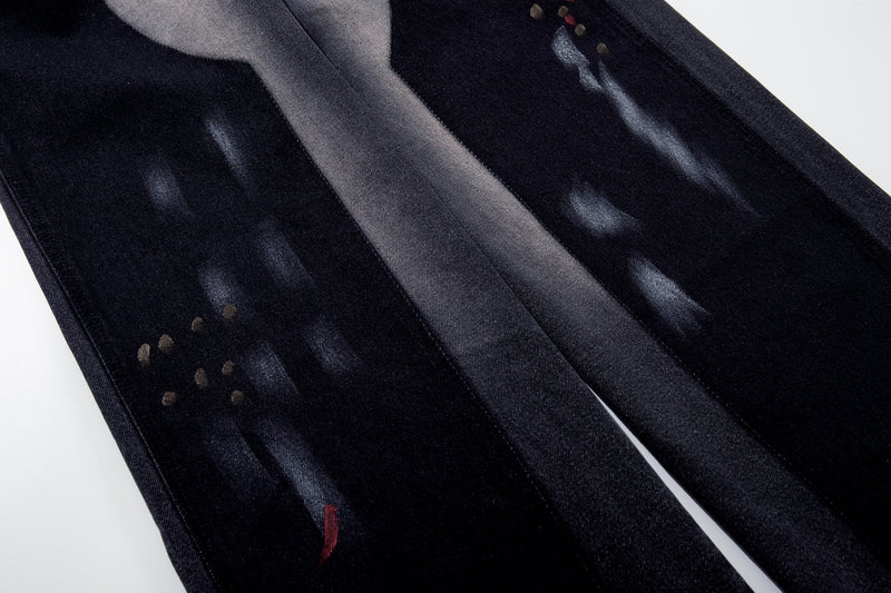 Brushstroke fade detail on dark wash wide-leg jeans leg