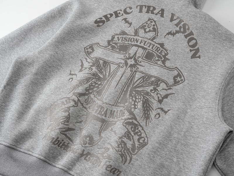 Close-up of gray hoodie back graphic with large crest and gothic lettering