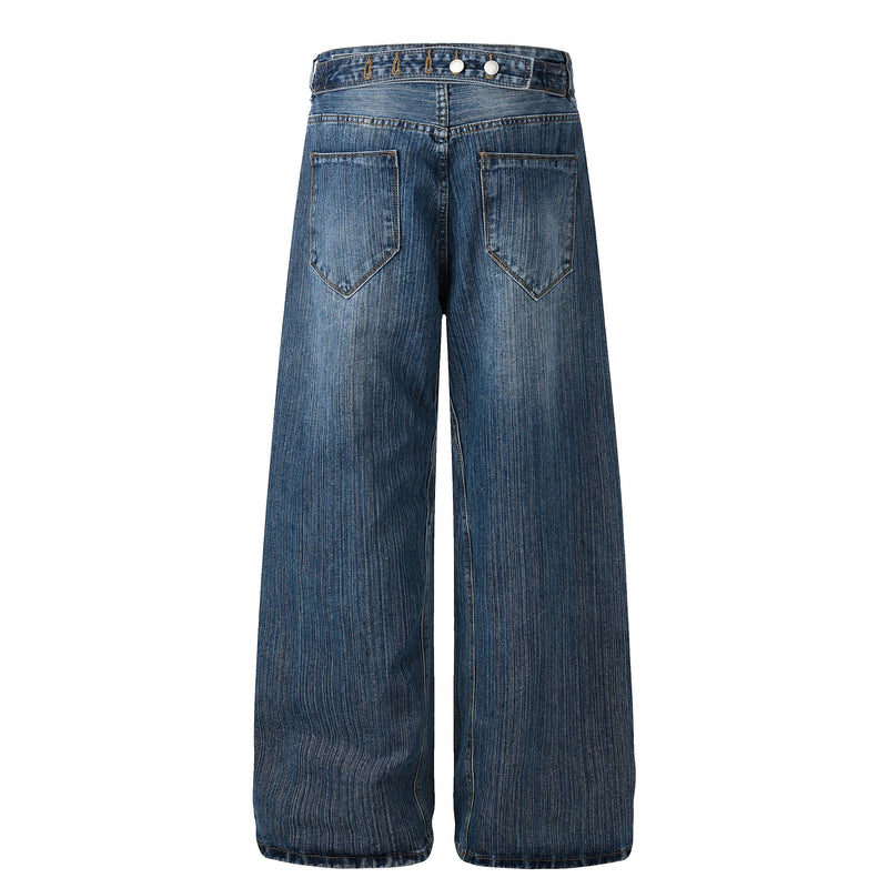 Back view of blue wide-leg denim jeans with two patch pockets and buckle-style waist detail